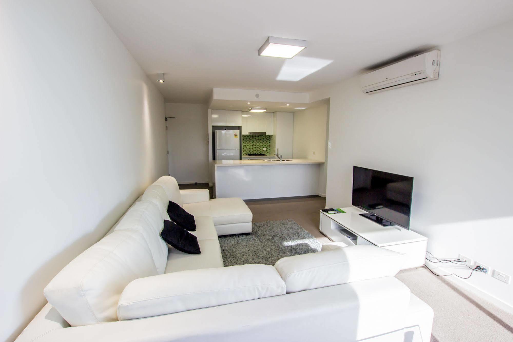 Eastwood Apartamentos Brisbane Exterior foto A living room in a modern apartment